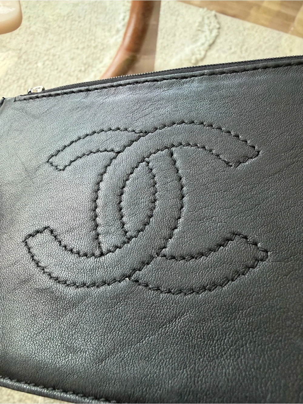 CHANEL CC Black Leather Zip Wallet with Branded Silver Pull.